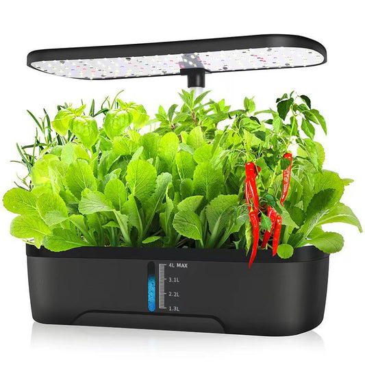 Black indoor garden with plants and a LED grow light on a white background