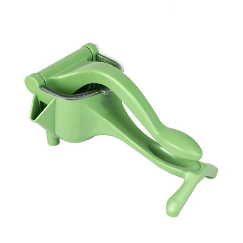 Green manual juicer on a white background