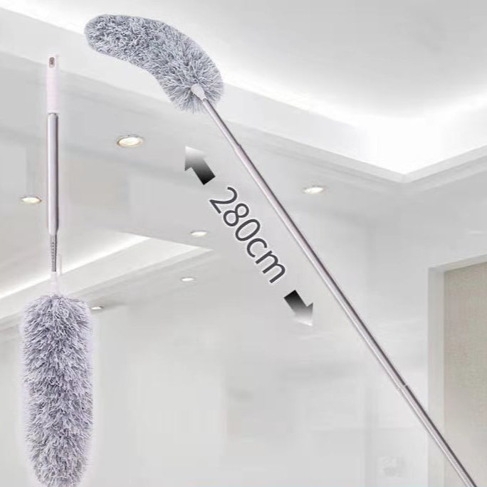 Extendable cleaning brush with feather duster head against a white ceiling background