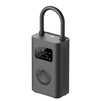 Black electronic device with digital display and control buttons.