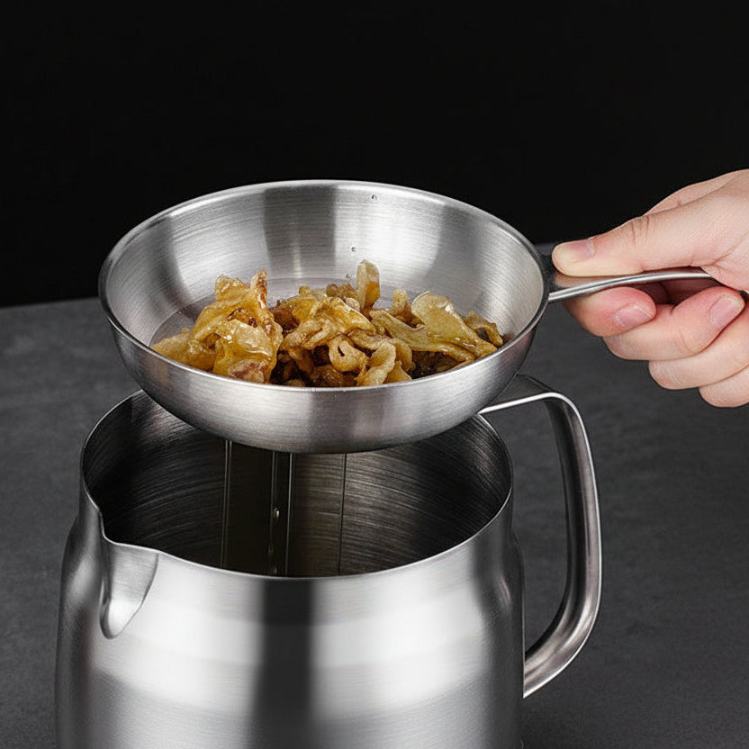 Stainless steel strainer with food being used over a pot, on a dark background.