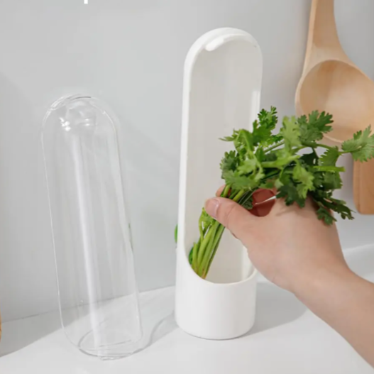 White herb storage container with a hand holding fresh herbs, with text 'Made of plastic material' above.