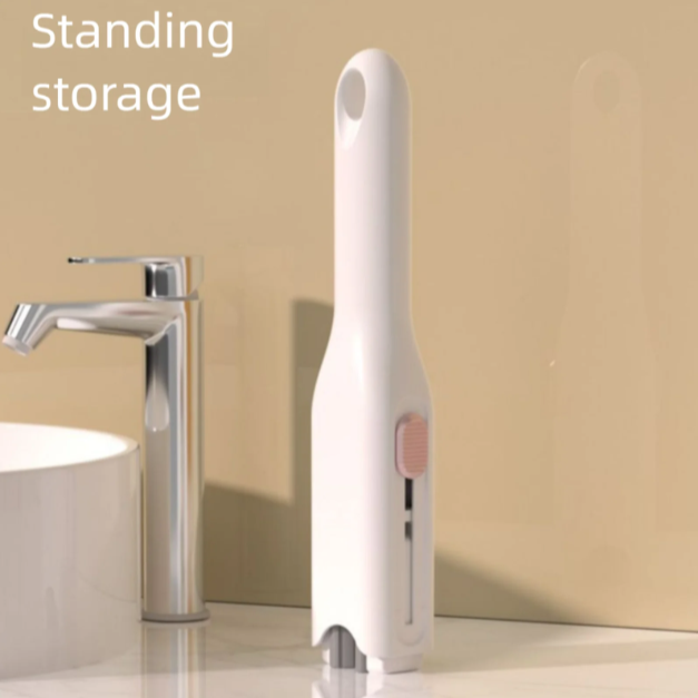 White standing storage mini portable cleaning mop next to a sink in a bathroom setting